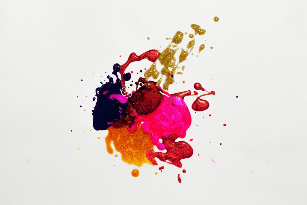 The image shows several splashes of color. These colors are blended together to project a creative representation of art.